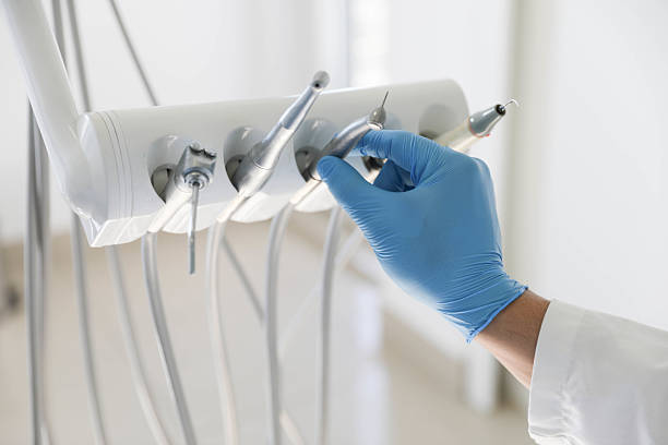 Professional Emergency Dentist technician working in Lansing, MI